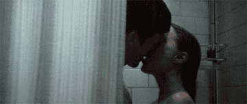 Natalie Portman and Ashton Kutcher kissing in the shower