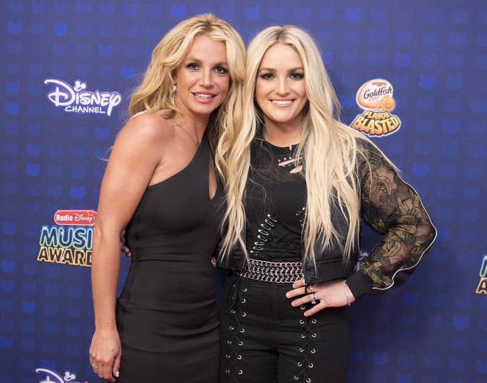 Britney and Jamie Lynn pose together on a red carpet in 2017