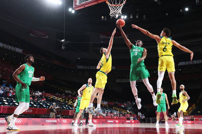 Caleb Agada of Team Nigeria attempts to score a goal against Team Australia in a basketball match during the Olympics