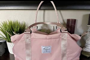 A reviewer's pink duffle bag