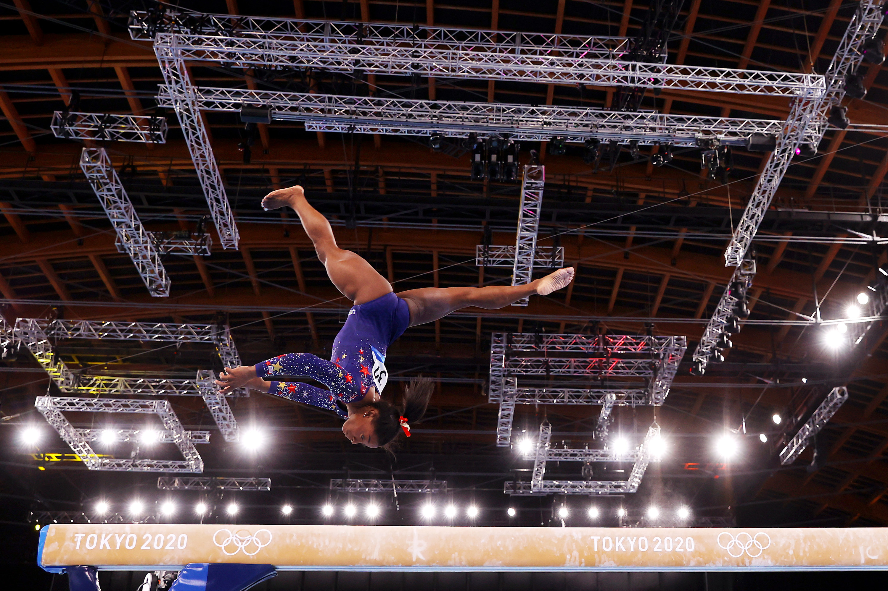 Simone performing on the balance beam