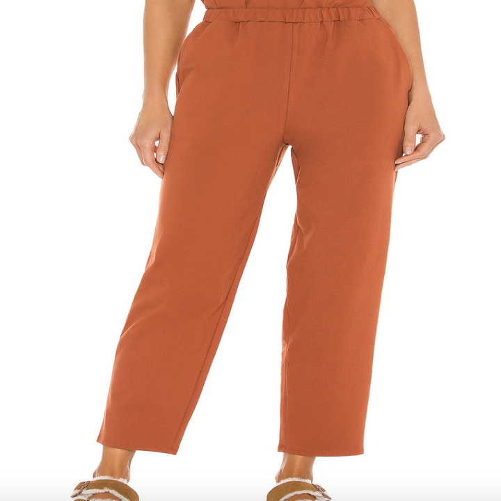 close up of a model wearing the res rust cropped pants