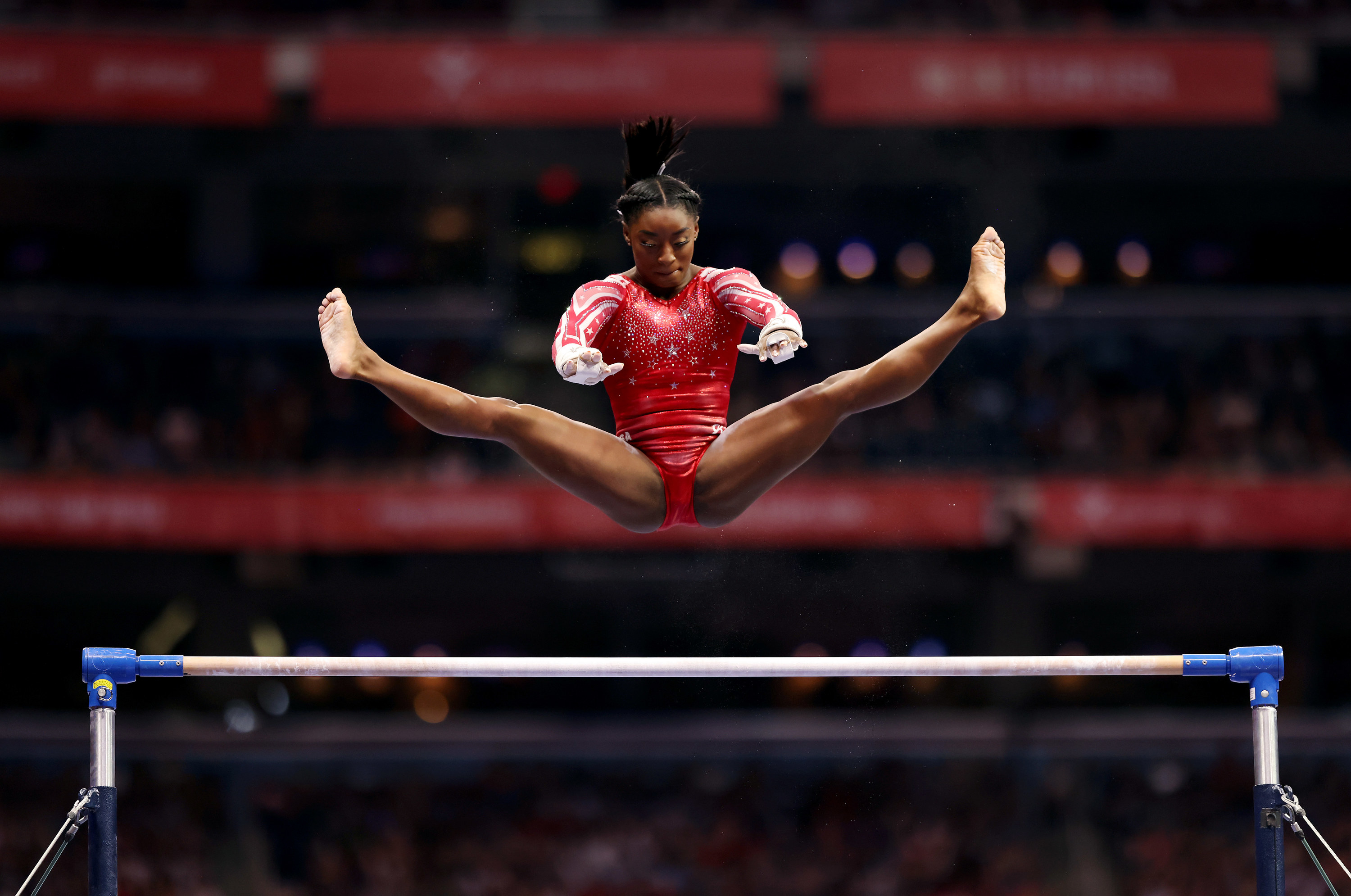 Simone high over the high bar