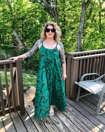 image of reviewer wearing the green maxi dress on a back deck