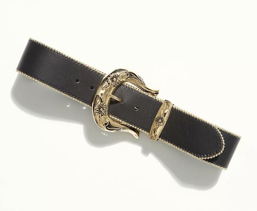 a Western buckle belt with a gold buckle and black leather