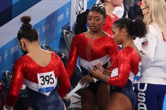 Simone standing with her teammates