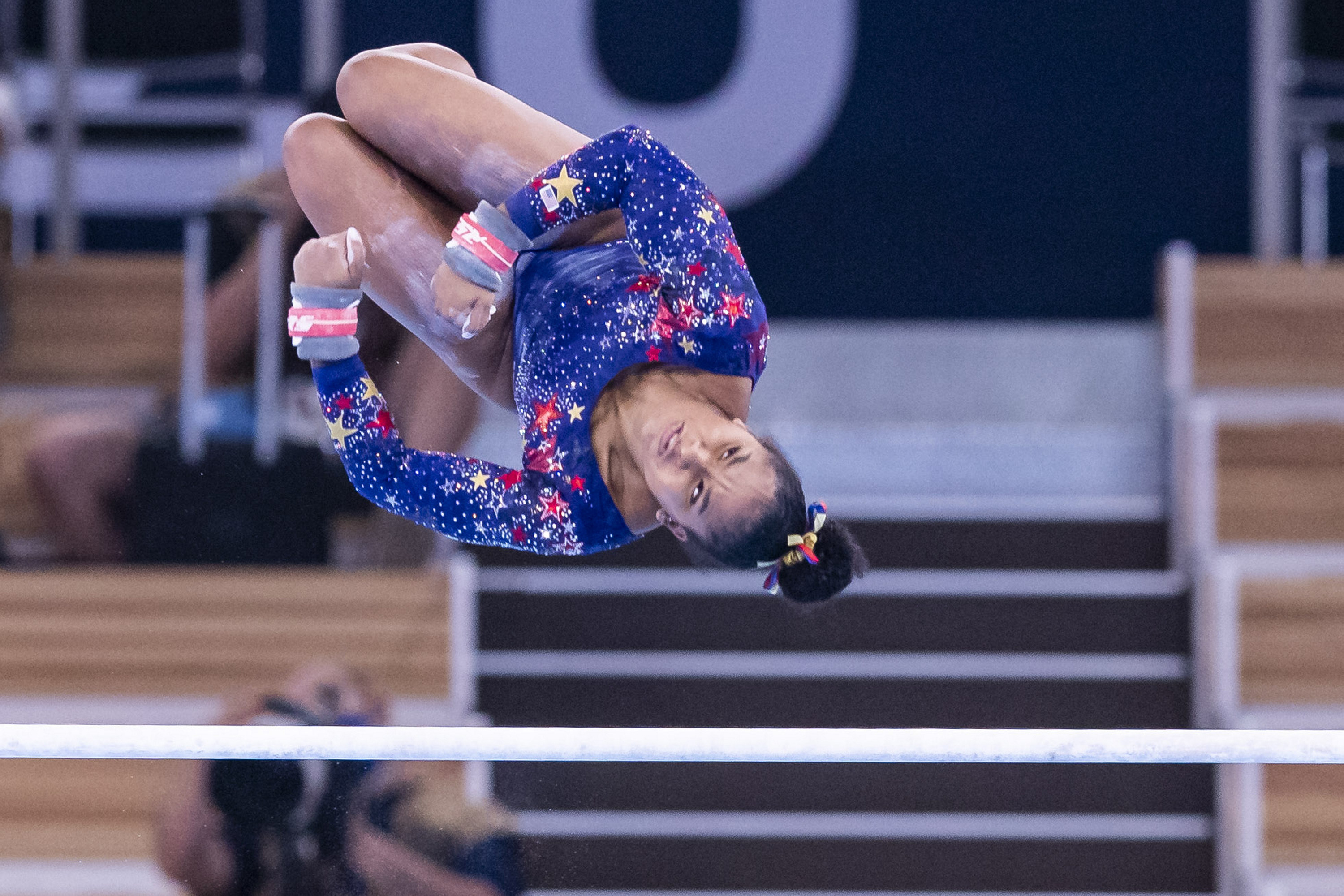 A gymnast twisting through the air