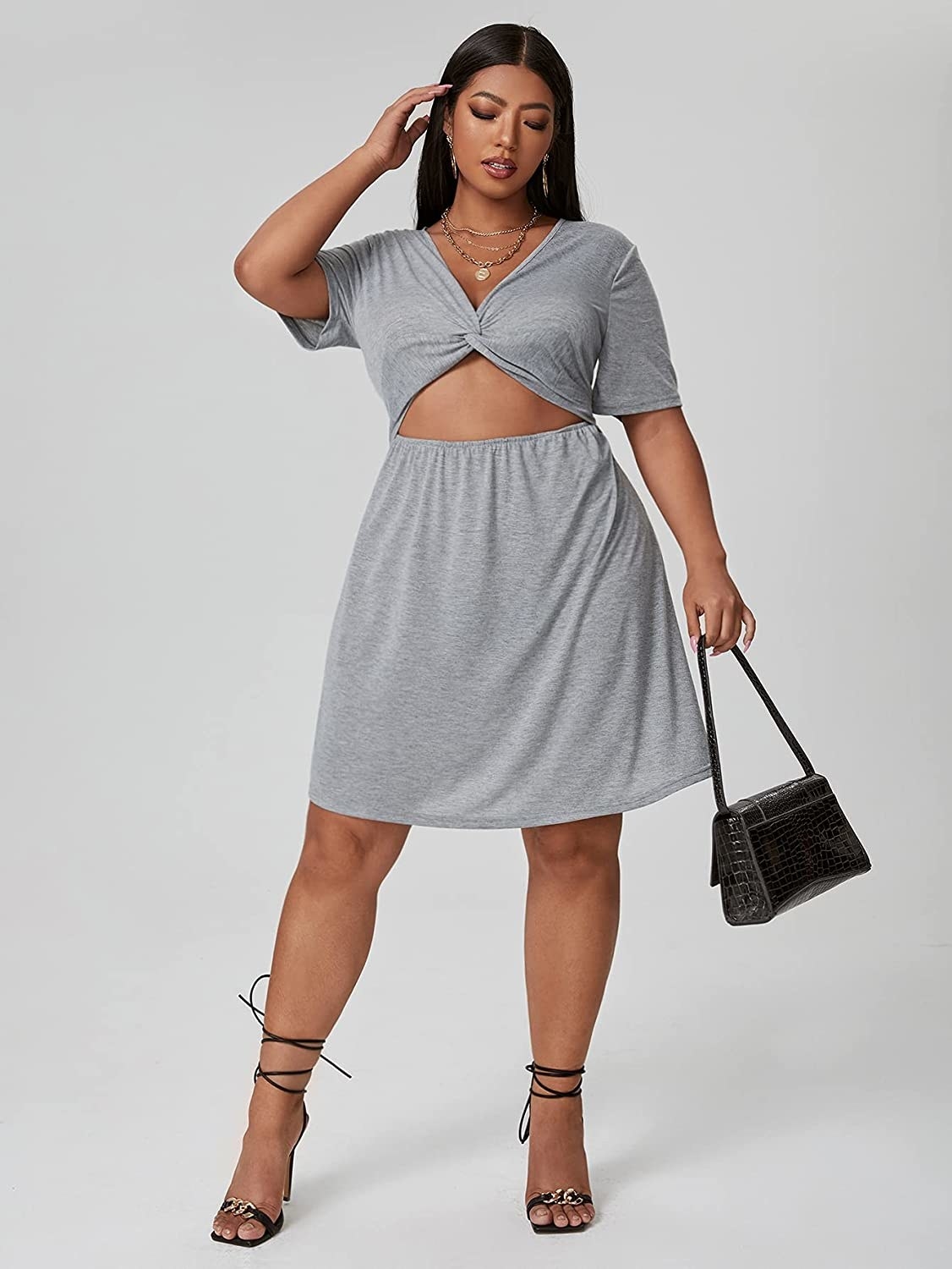 a plus size model wearing the grey Short Sleeve Cutout Twist Front V Neck Summer A Line Skater Dress