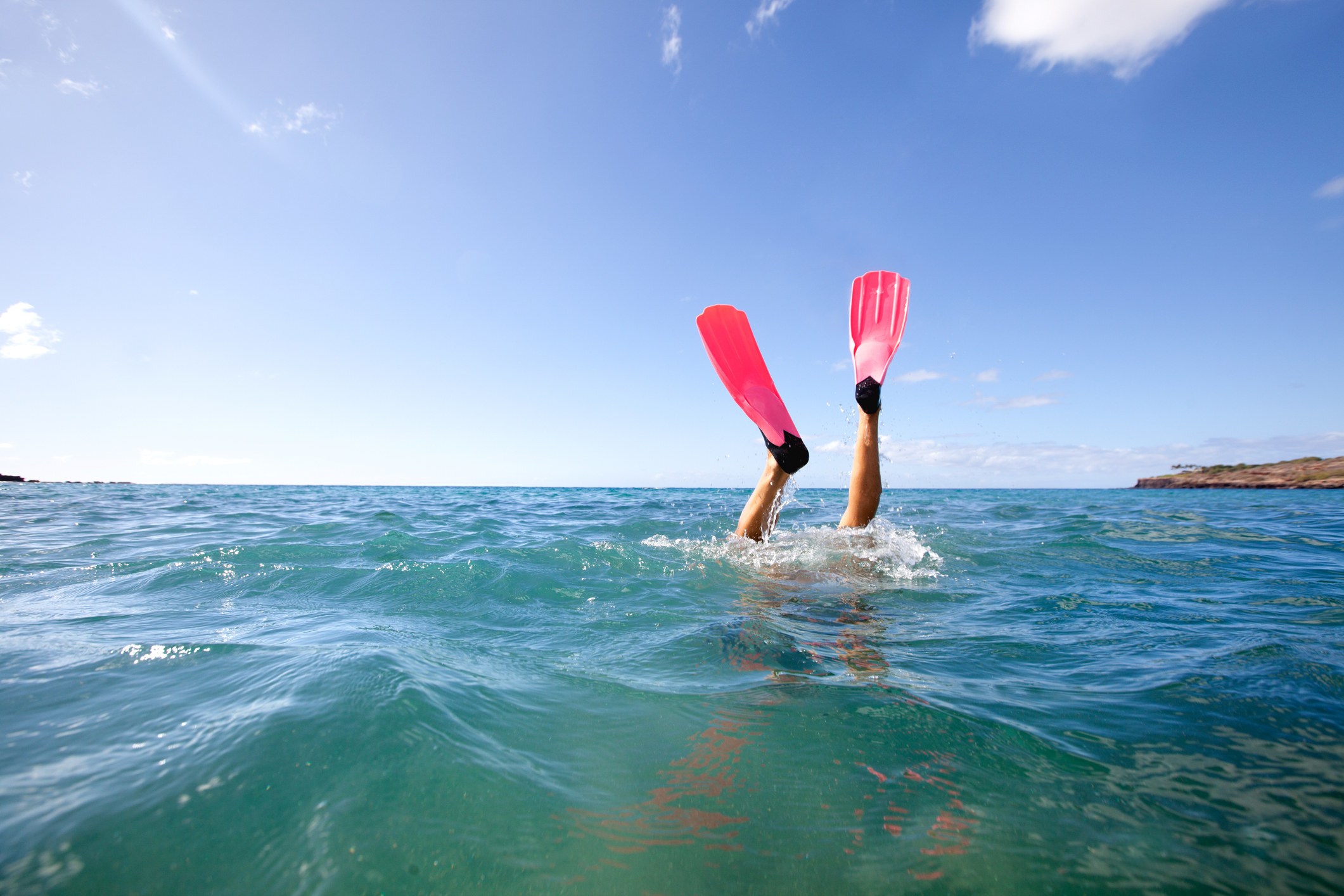Snorkel fins or flippers showing from snorkeler diving