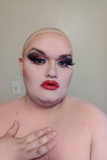 reviewer wearing heavy foundation, powder, eyeshadow, lipstick, and lashes