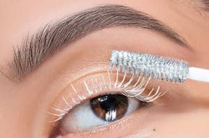 A model applies the white mascara primer