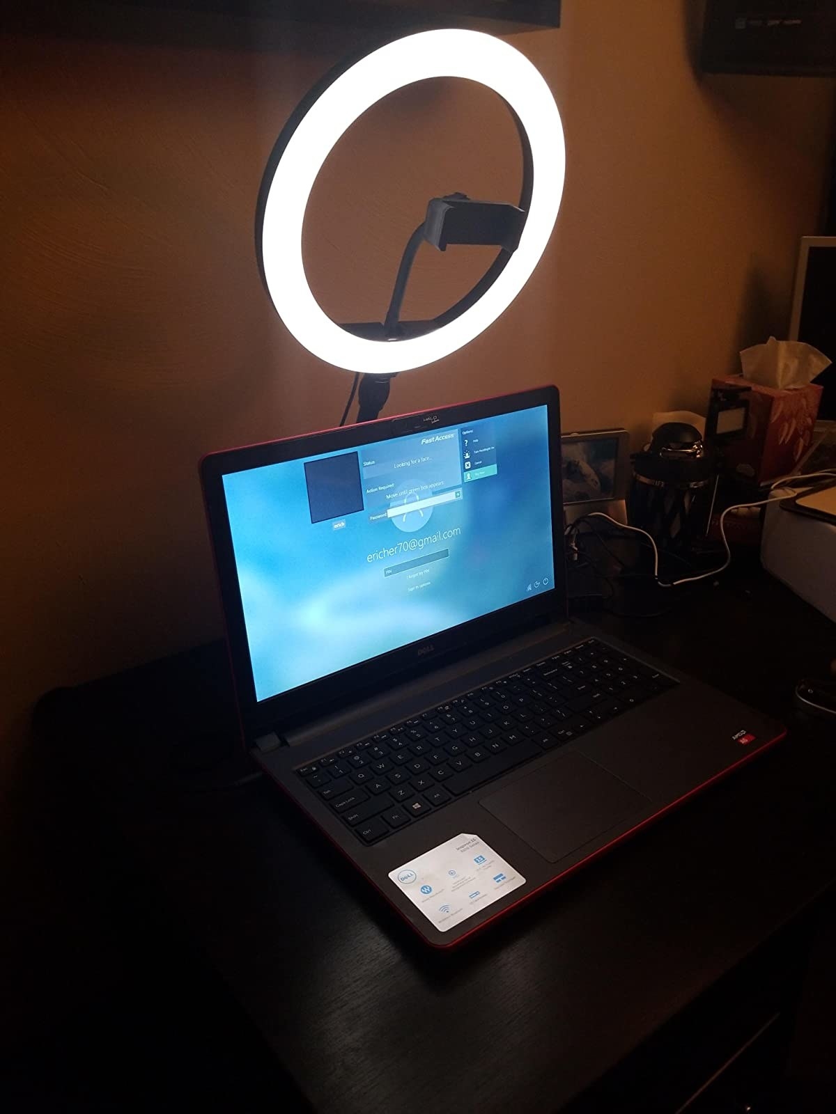 reviewer image of a lit up ring light clamped to an open laptop