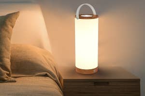 the lamp sitting on a nightstand 