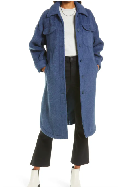 A model wearing the shirt jacket in blue vintage