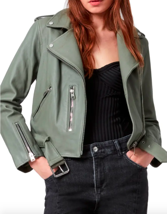 A model wearing the biker jacket in sage green