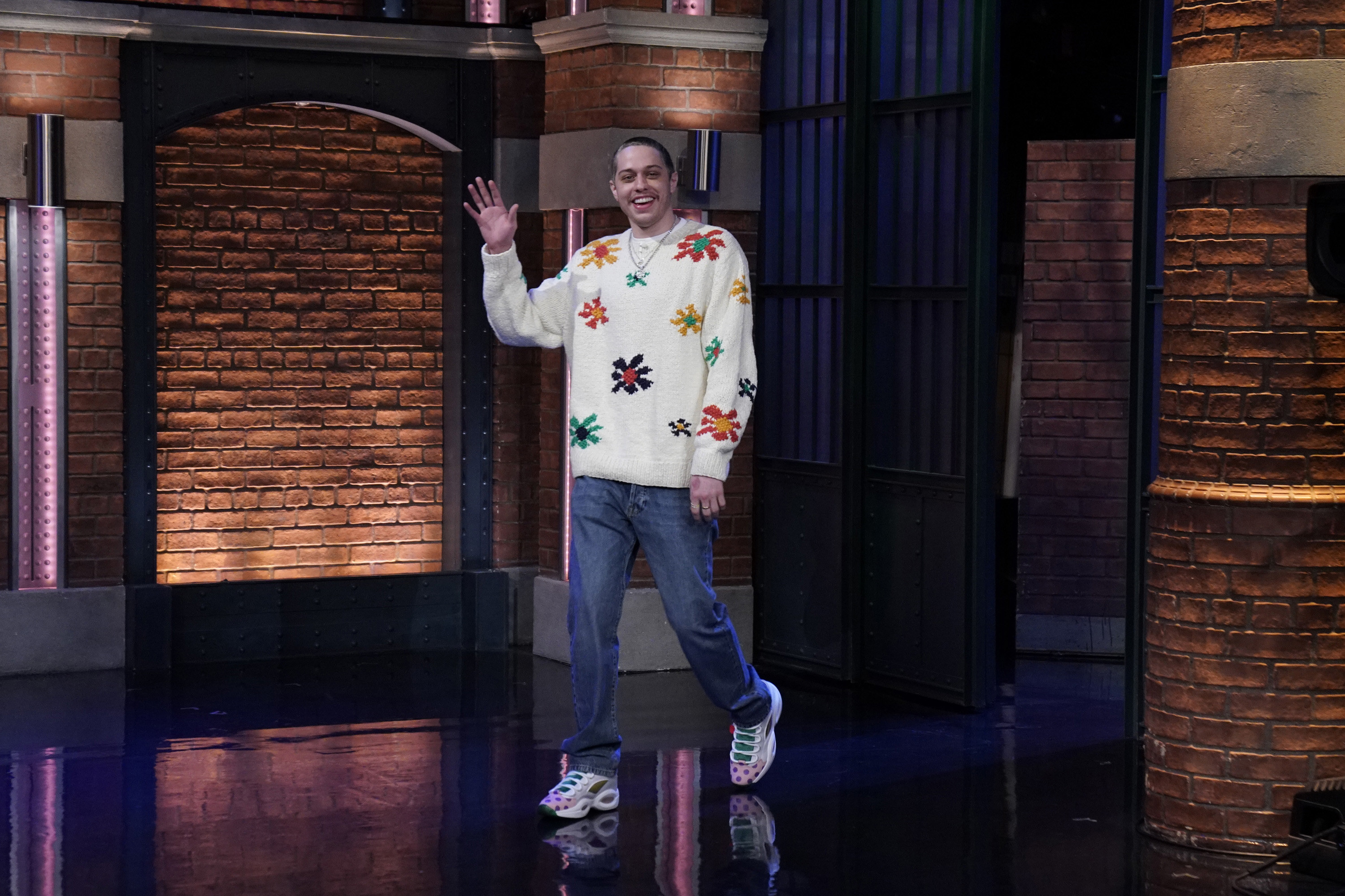 Pete Davidson waves to the audience during an appearance on Late Night With Seth Meyers in 2021