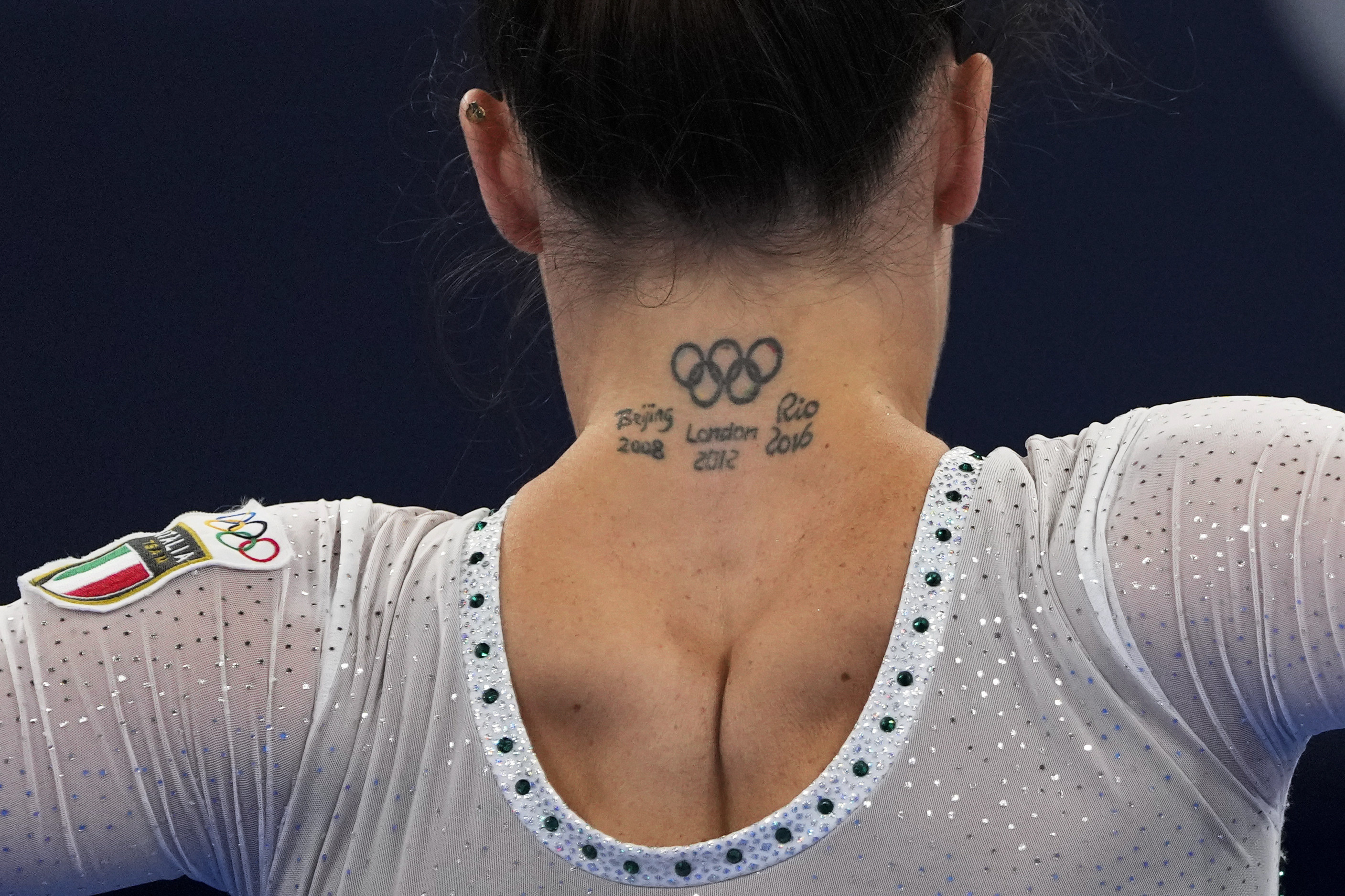 Close-up view of the back of Italian Olympic gymnast&#x27;s neck tattoos