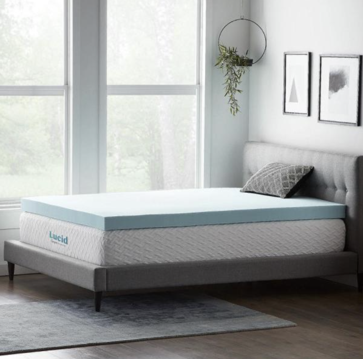 lifestyle image of mattress topper on top of a mattress in a bedroom