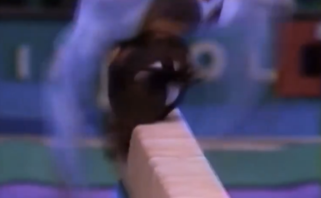 Dominique Moceanu landing on her head during her beam routine