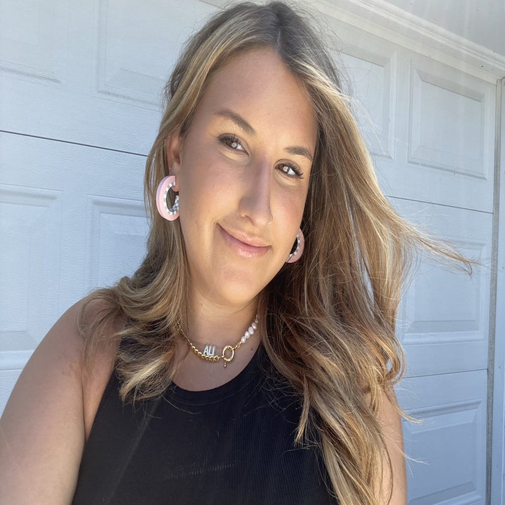 Ali wearing pearl and chain necklace