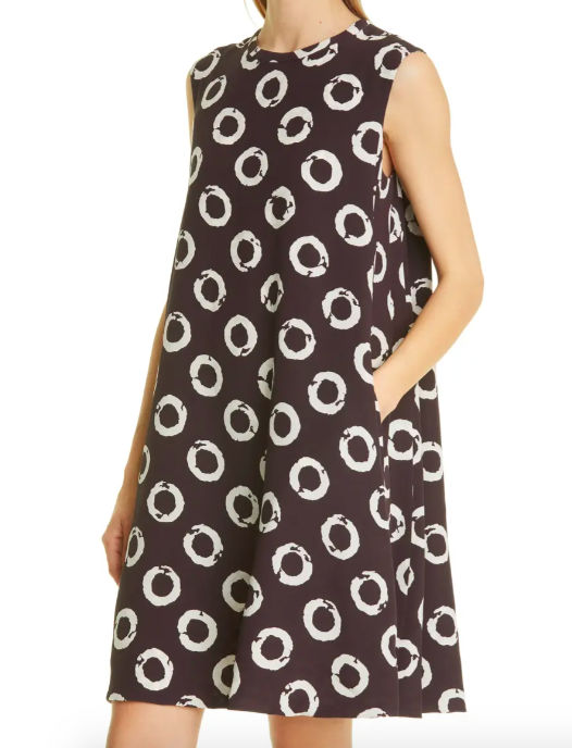 A model wearing the dress with her hand in her pocket