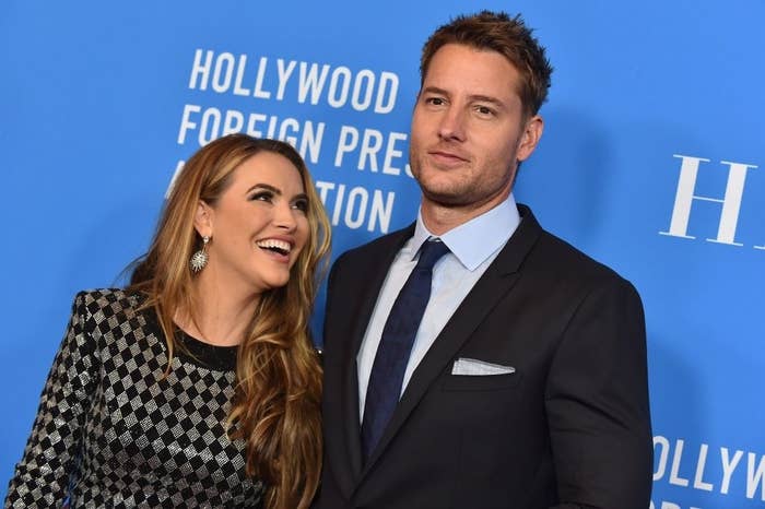 Chrishell looking up and smiling at Justin on a red carpet