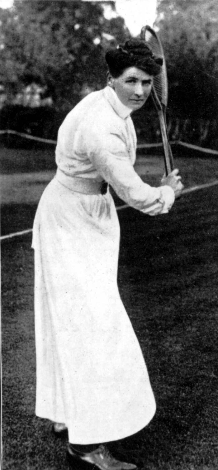 Charlotte Cooper holding a tennis racket