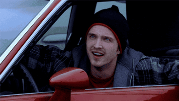 Jesse Pinkman at the wheel of a car and saying &quot;What?&quot;