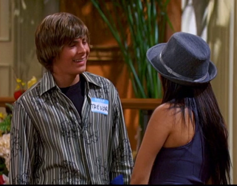 Zac Efron talks to Brenda Song in the Tipton lobby