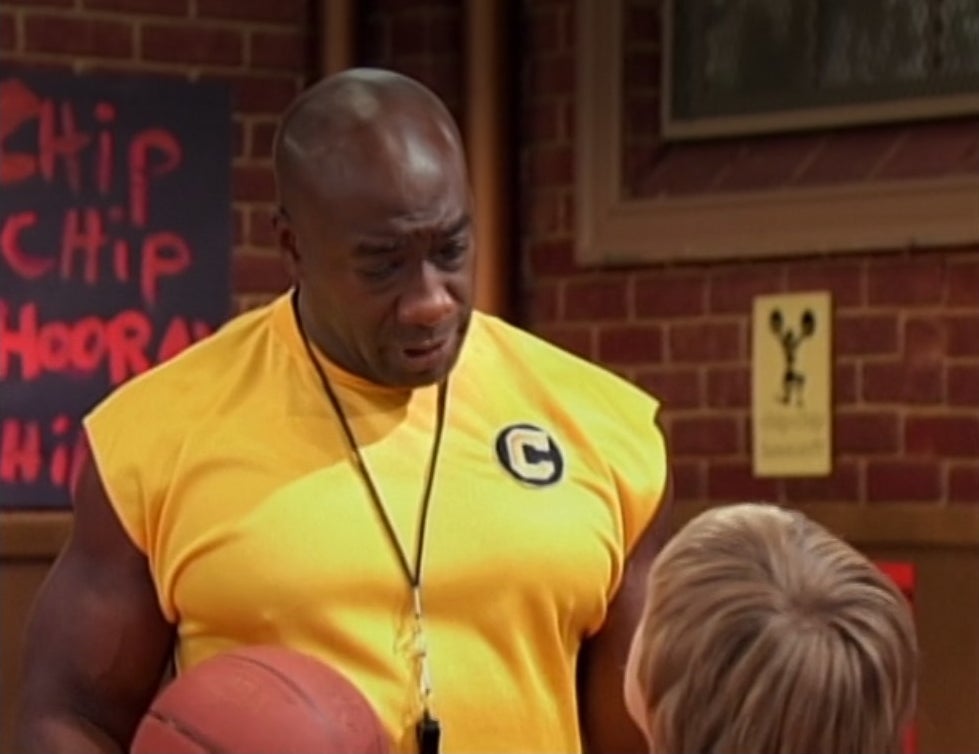 Michael Clarke Duncan holding a basketball and wearing a whistle