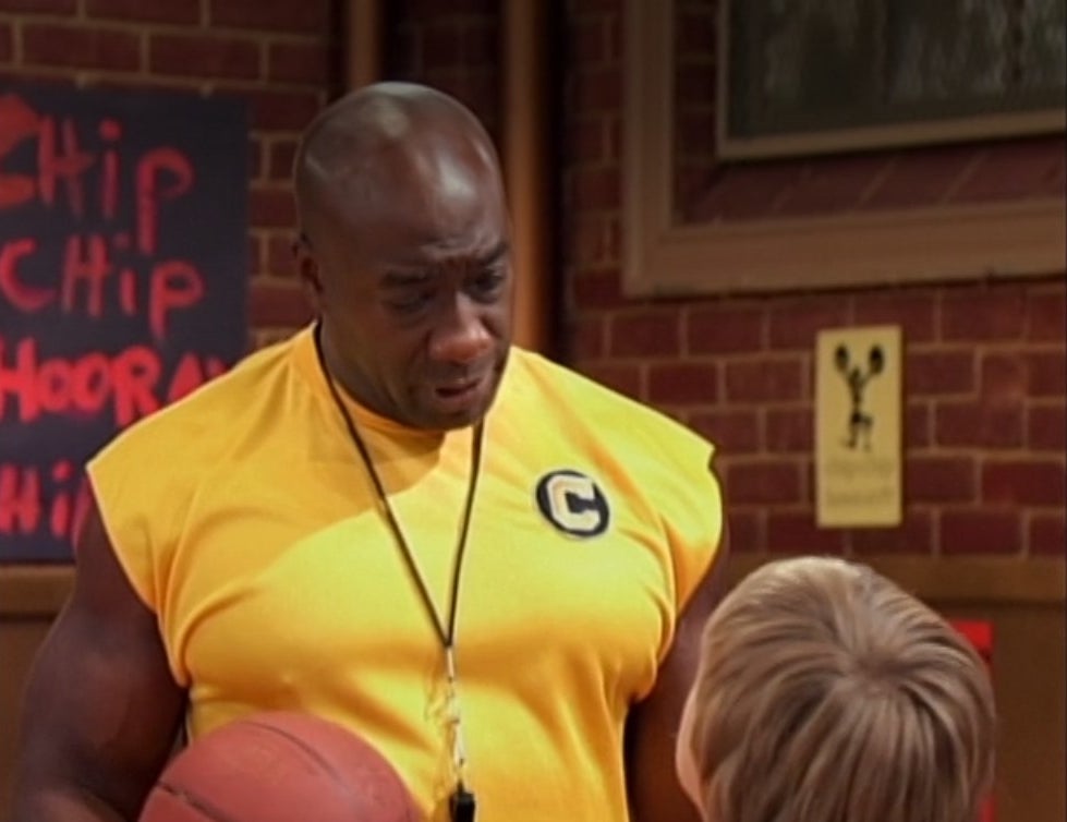 Michael Clarke Duncan holding a basketball and wearing a whistle