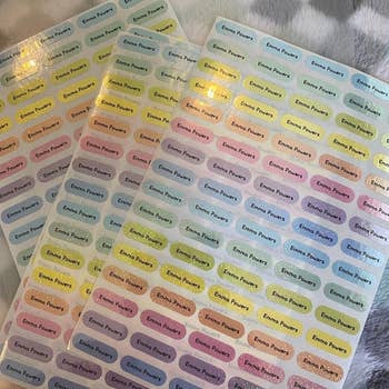 Reviewer's photo showing three sheets of the personalized name labels
