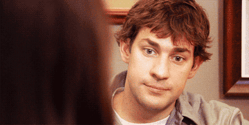 GIF of Jim from The Office holding back a comment