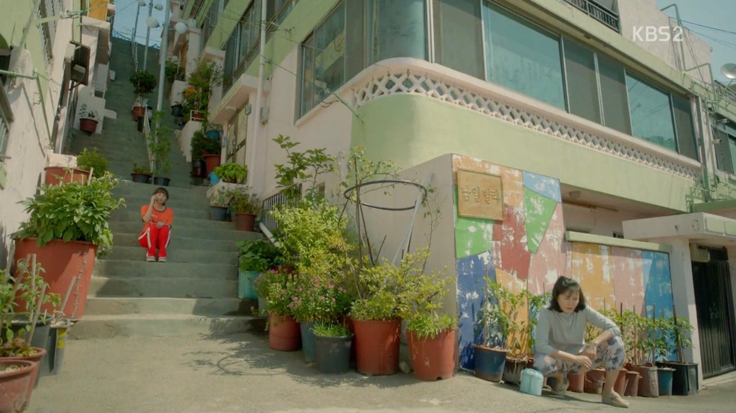 Character sitting on stairs of apartment villa