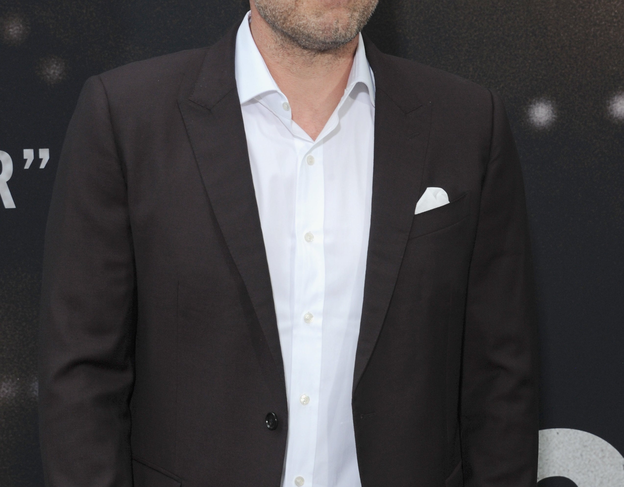 Ben smiles while attending a premiere