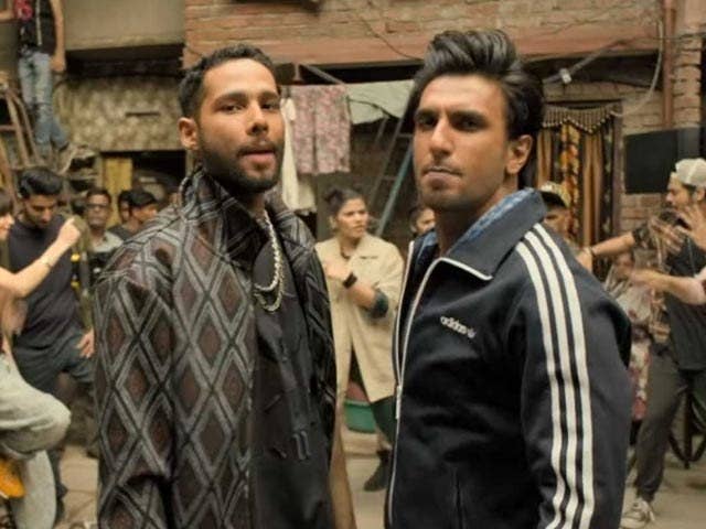 Ranveer singh and siddhant chaturvedi&#x27;s characters stare into the camera in a still from the movie gully boy