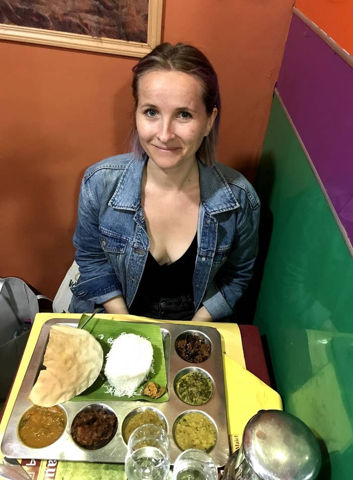 Woman eating Indian food