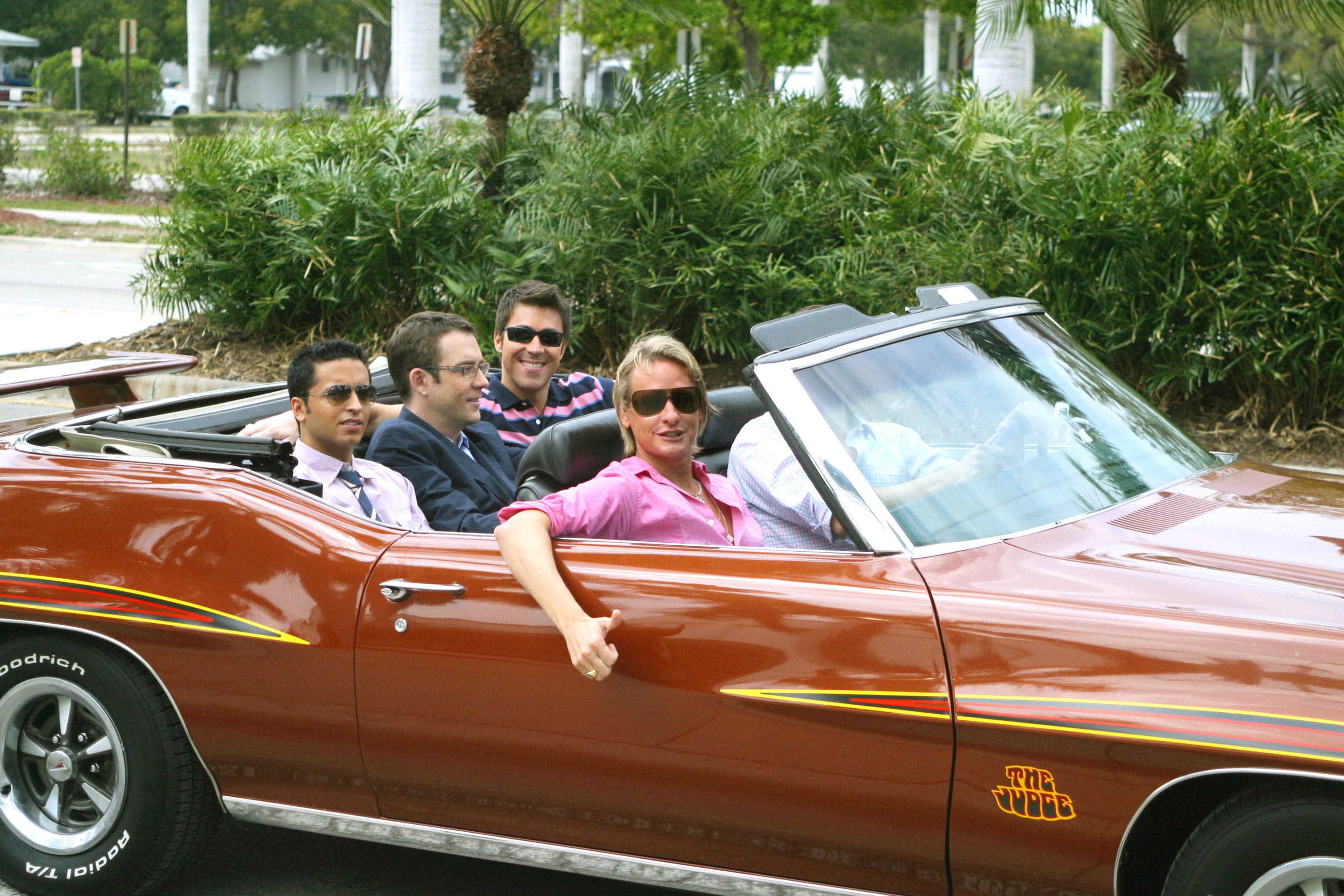 Jai Rodriguez, Ted Allen, Kyan Douglas, Carson Kressley, and Thom Filicia ride in a convertible