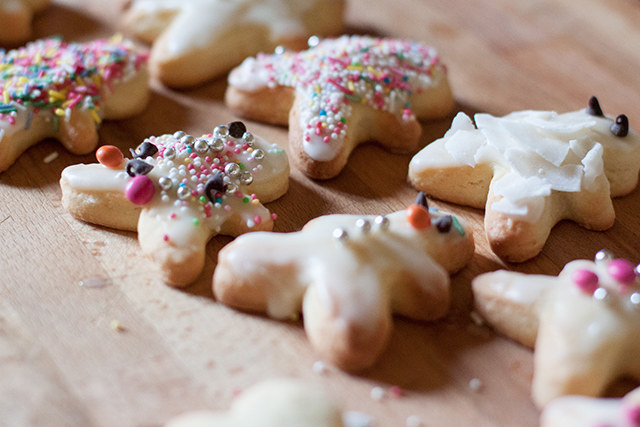 Tiny shortbread cookies decorated with colorful sprinkles and icing
