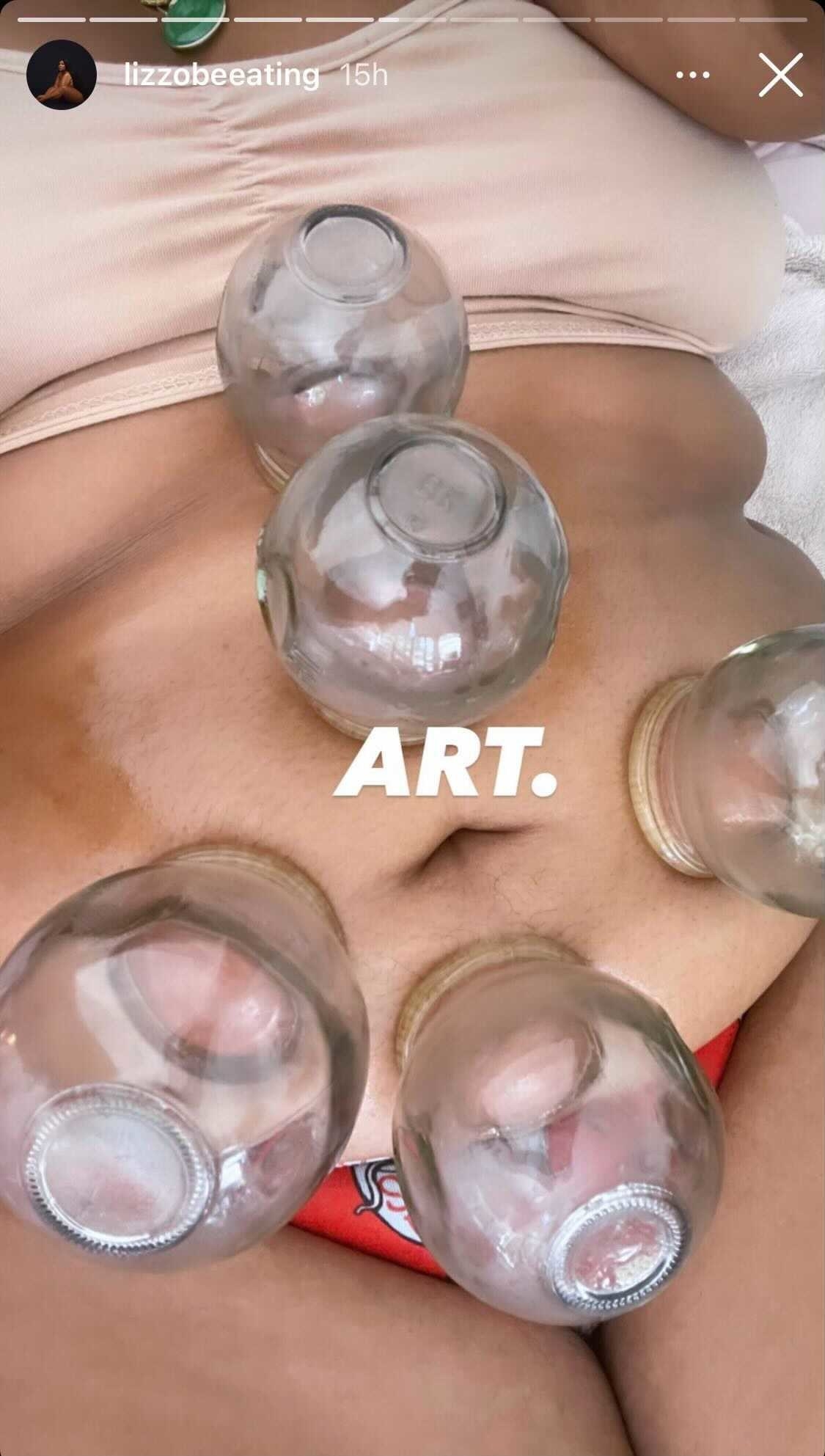 A screenshot taken from Lizzo&#x27;s Instagram Story shows her cupping her stomach