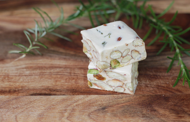 Two squares of chunky torrone, one on top of the other