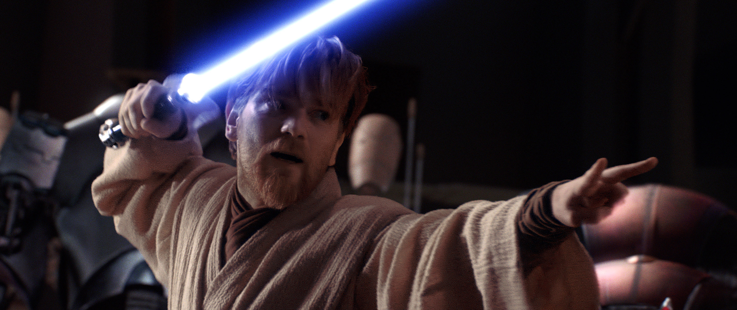 Ewan McGregor holding a lightsaber.