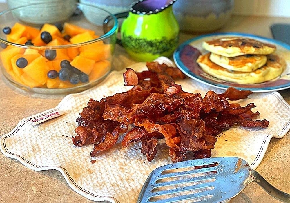 bacon resting on the bacon sponge which has absorbed all its grease and oil