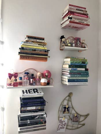 A postulation of books are displayed connected a wall