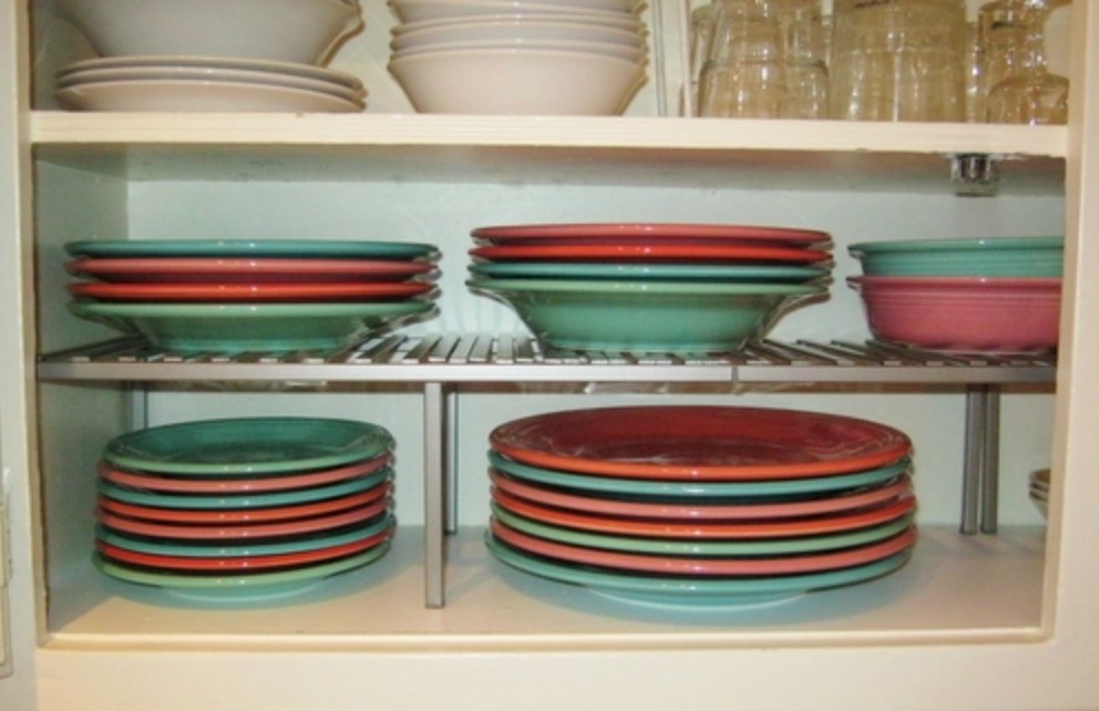 the expandable kitchen counter holding colorful dishes