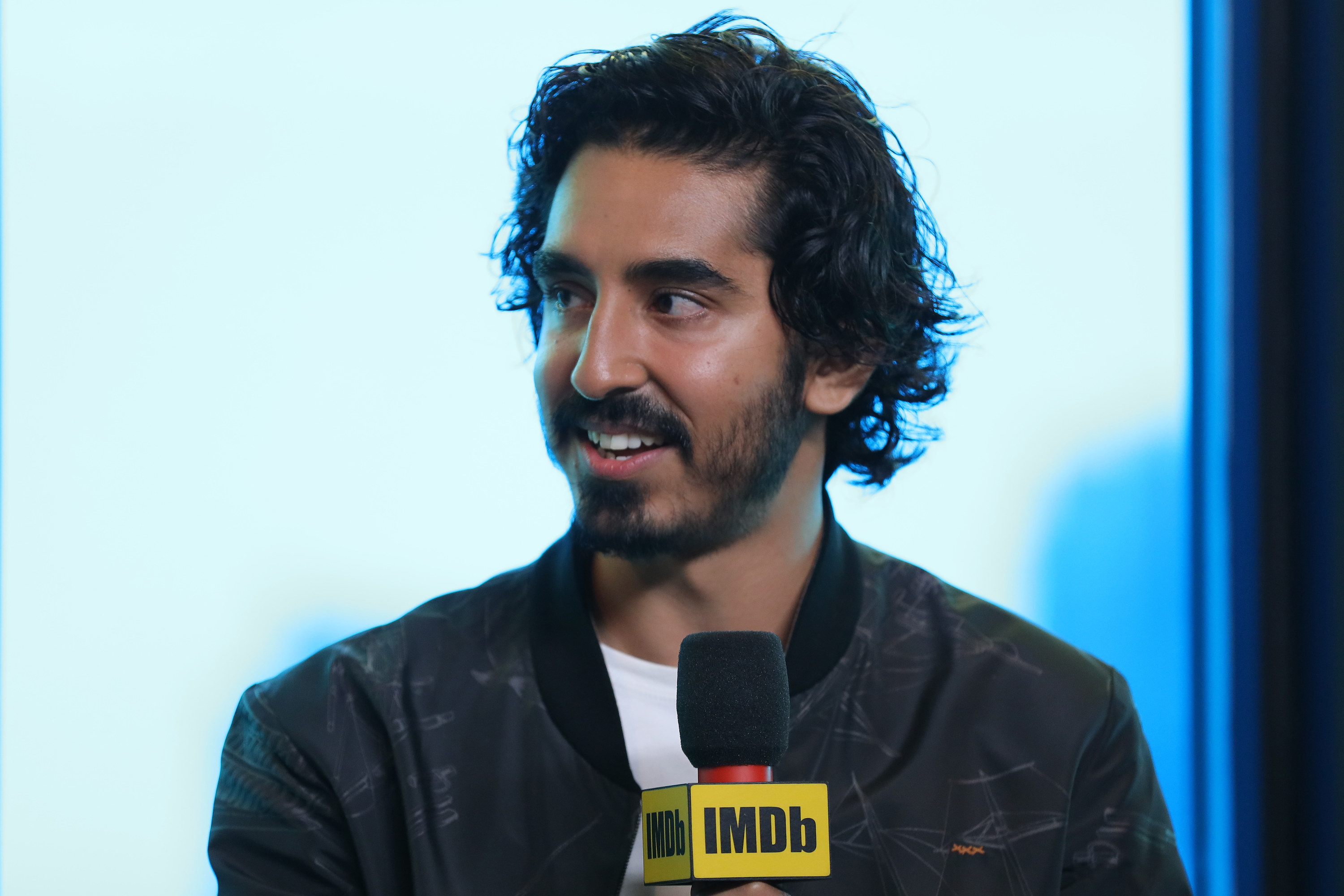 Dev Patel speaks at an event in 2019