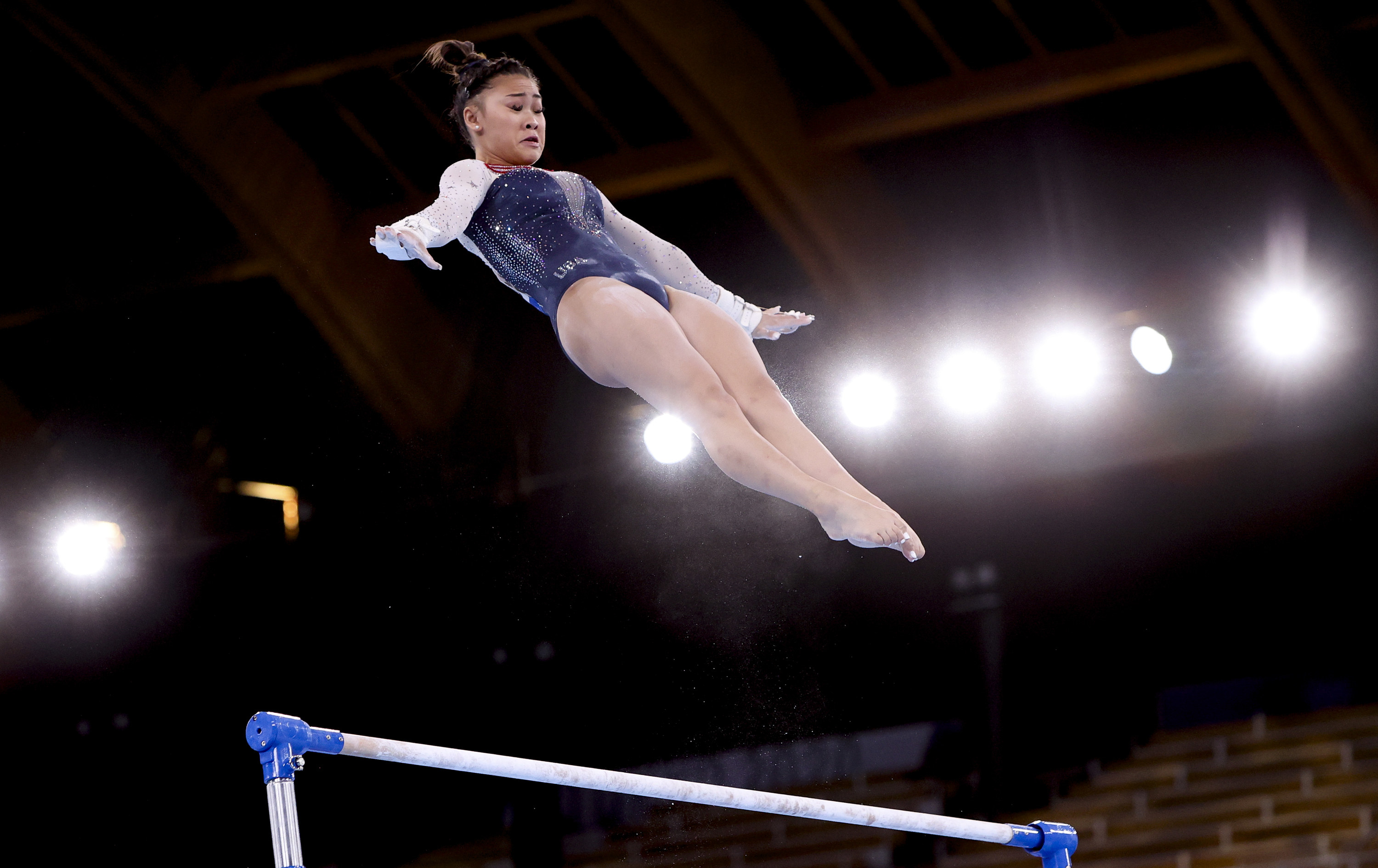 Sunisa Lee competes on the uneven bars