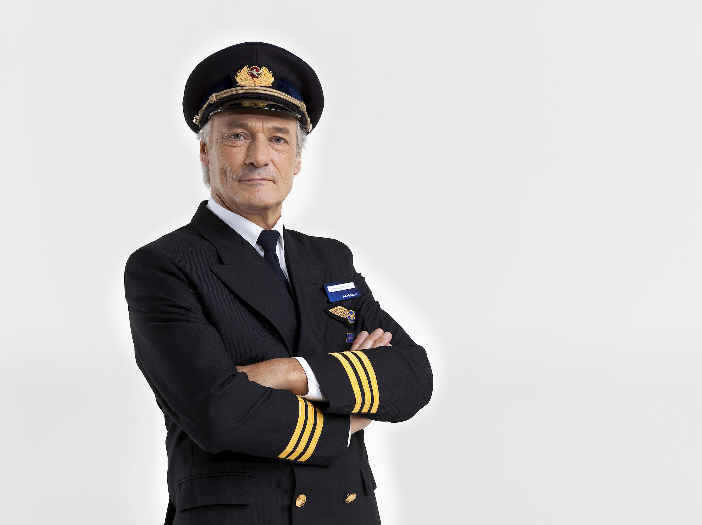 An older an in a pilot uniform