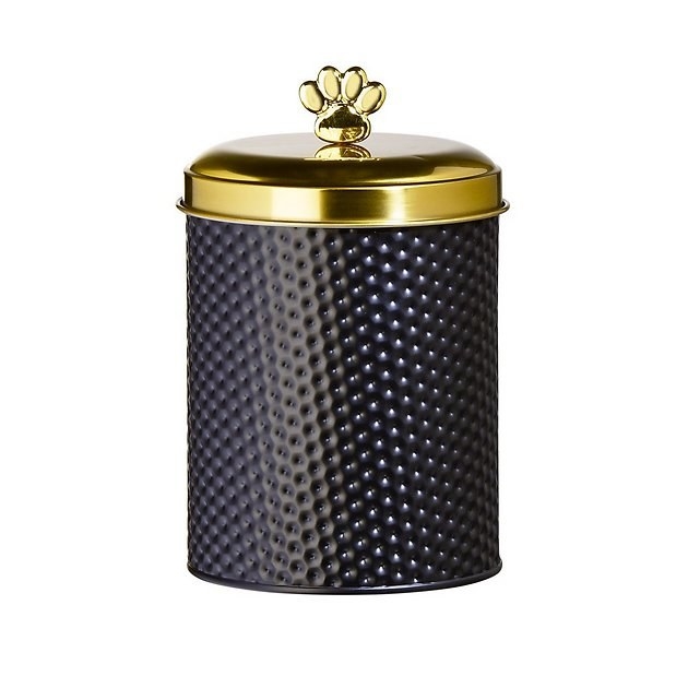 The black and gold hammered metal canister with paw print knob