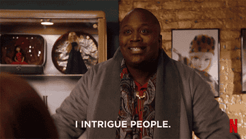 GIF of person saying &quot;I intrigue people&quot;